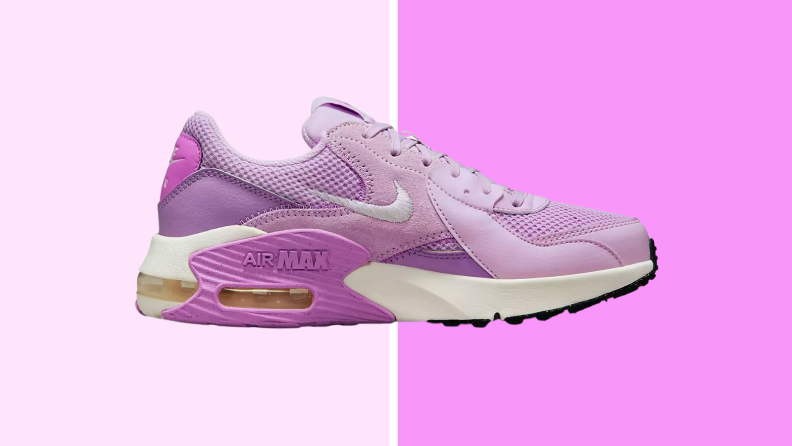 An image of a single pink and periwinkle Nike Air Max sneaker with white soles and pale pink laces.