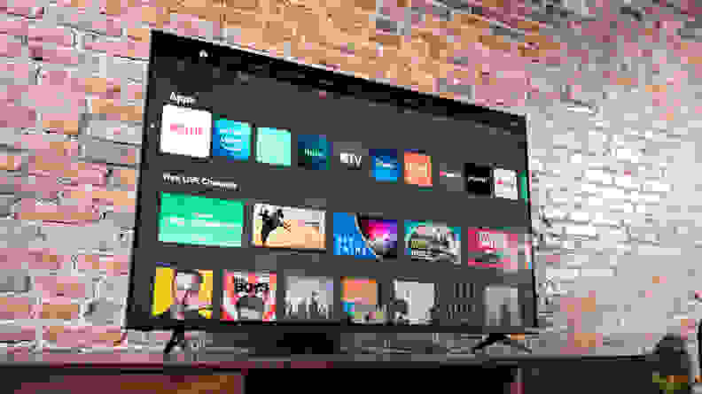 The Vizio M-Series MQ6 displaying its home screen in a living room setting