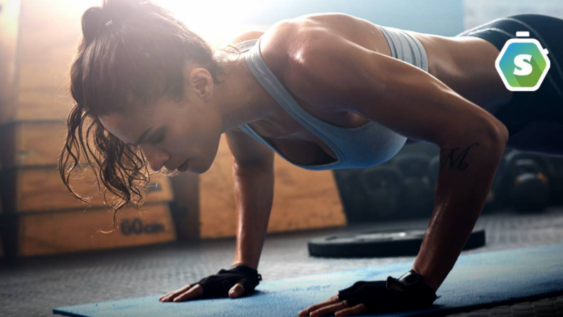 A woman doing a pushup.