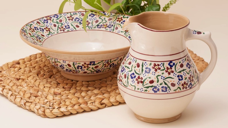 Nicholas Mosse hand-painted jug next to hand-painted bowl plate on a table