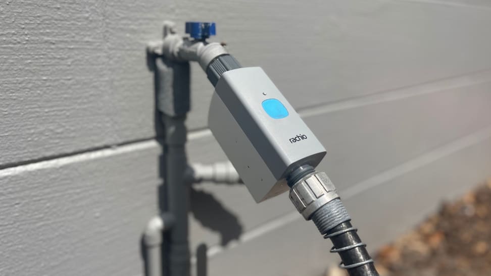 The Rachio Smart Hose Timer connected to a garden hose outside