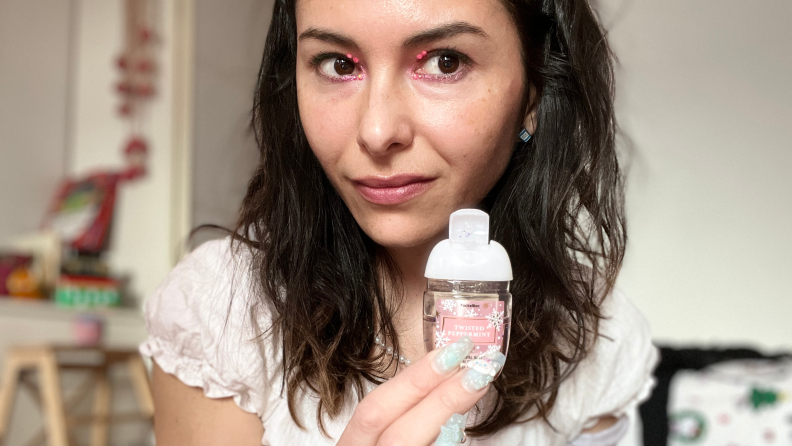 Author holding a Bath and Body Works hand sanitizer.