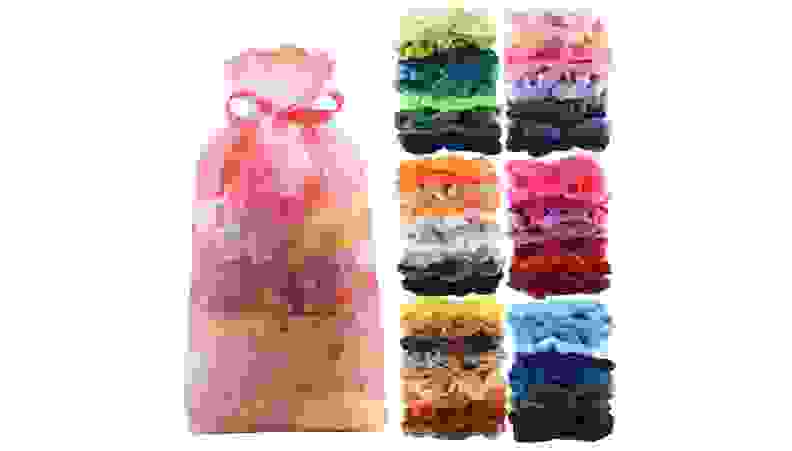 A stack of multicolored hair ties against a white background.