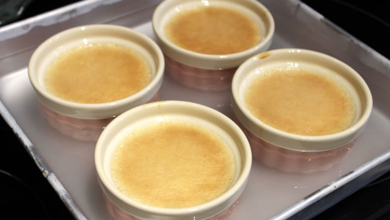 My crème brûlée never set and developed a cake-like film over the top.