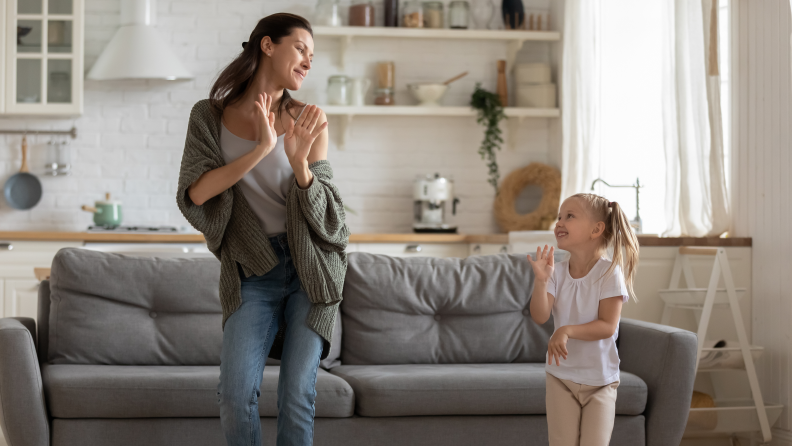 A mom and child rock out to a dance party.