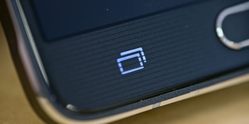 A photograph of the Samsung Galaxy Note 4's capacitive recent apps button.