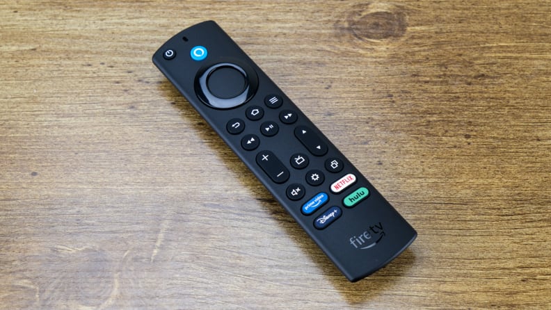 The included remote for the Amazon Fire TV Cube sitting on a wooden table.