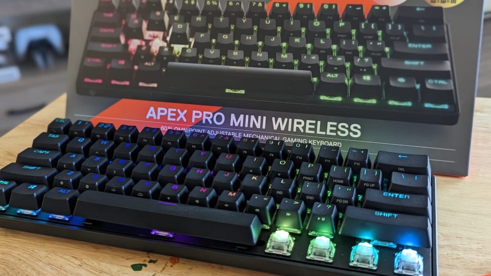 A black Apex Pro Mini keyboard with bright multicolored rainbow lights.