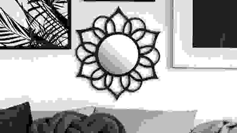 This decorative mirror has a flower-inspired silhouette.