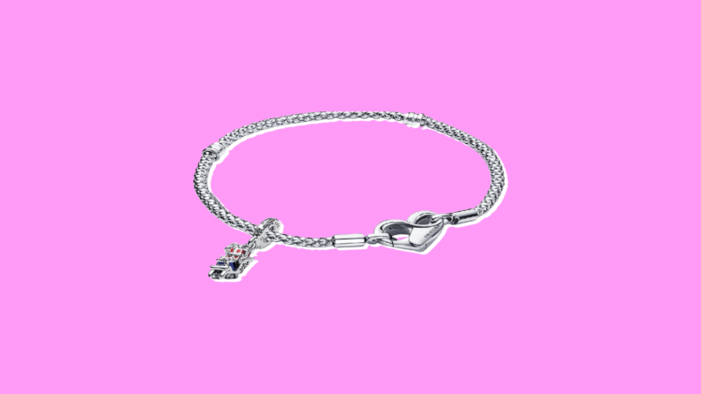 A Pandora Charm Bracelet on a purple background.