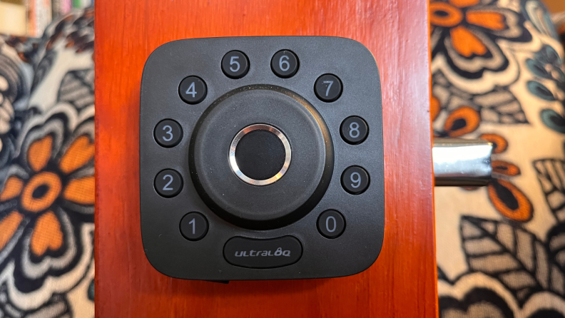 U-tec’s Ultraloq U-Bolt Pro Wi-Fi smart lock installed on a scaled down door for product testing