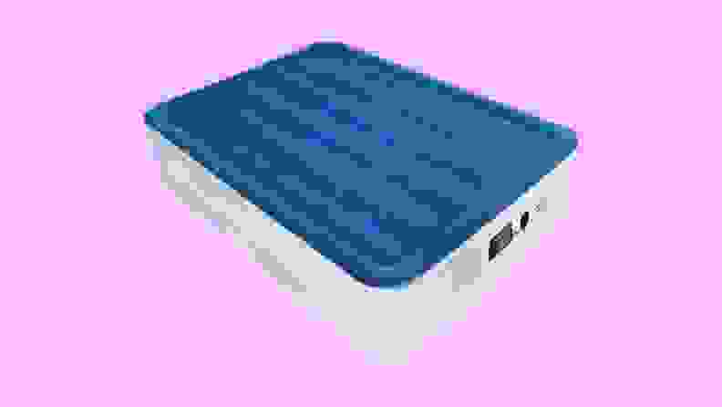 A gray SoundAsleep air mattress with a blue top layer on a purple background.