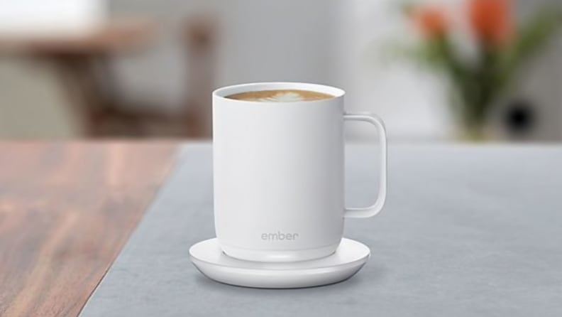 A whit coffee mug on a table.