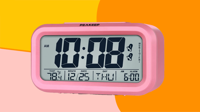 Pink rectangle-shaped alarm clock with big LED display.