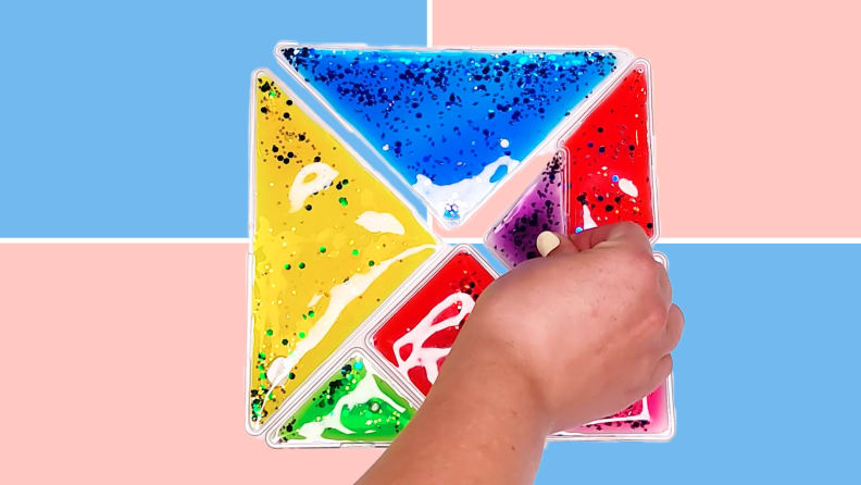 Person using hand to construct Fun and Function Busy Fingers Tangram Gel Puzzle.