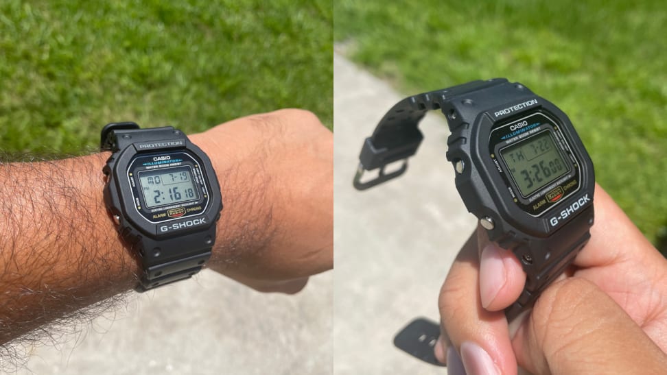 arm with G-Shock DW5600E-1V on it, hand holding G-Shock DW5600E-1V