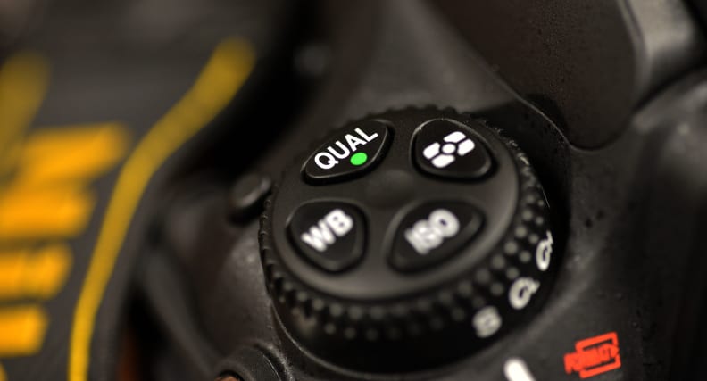 The top control cluster is one of the few layout changes compared to the D800, with the bracket button getting relocated.