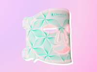 Omnilux Contour Face Mask against a purple and pink background