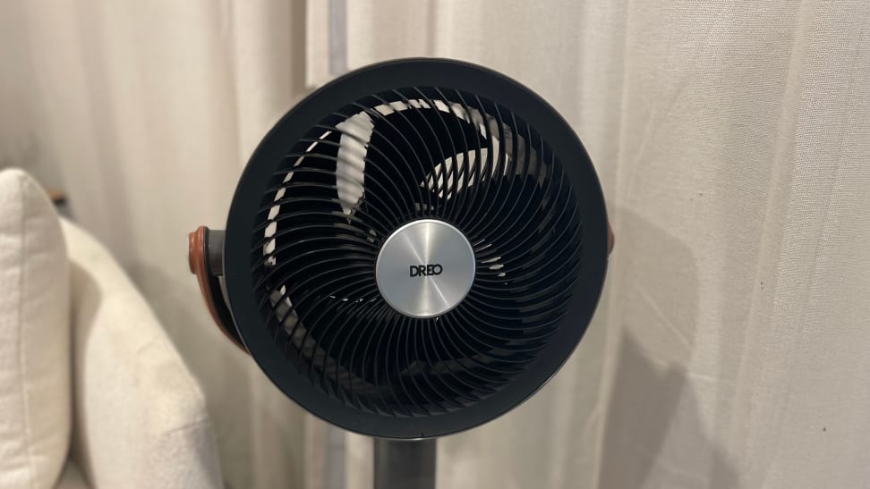 The black Dreo PolyFan Max S in a room with white curtains.