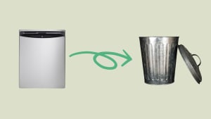 A dishwasher follows an arrow into a metal trashcan