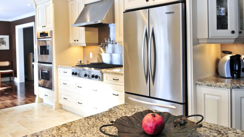 A counter-depth fridge installed in a modern kitchen.