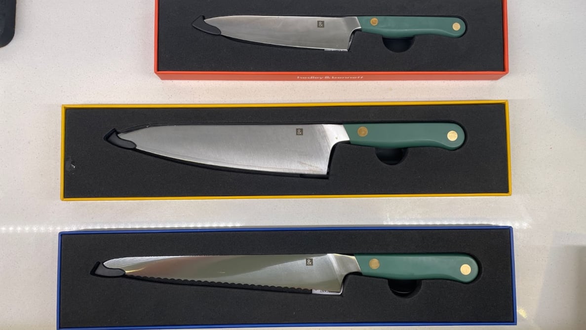 Hedley & Bennett knife set sitting inside of individual boxes on countertop.