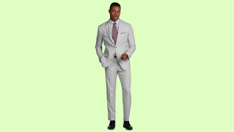 A model wearing a light gray suit.