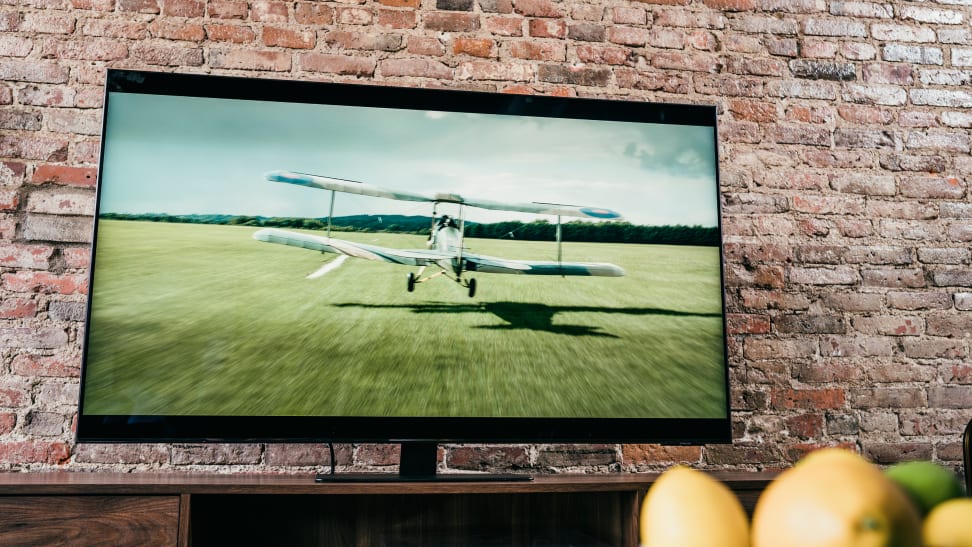 The Samsung QN85A displaying 4K content in a living room setting.