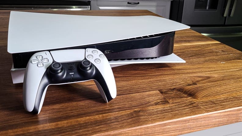 The playstation 5 and its controller on a table