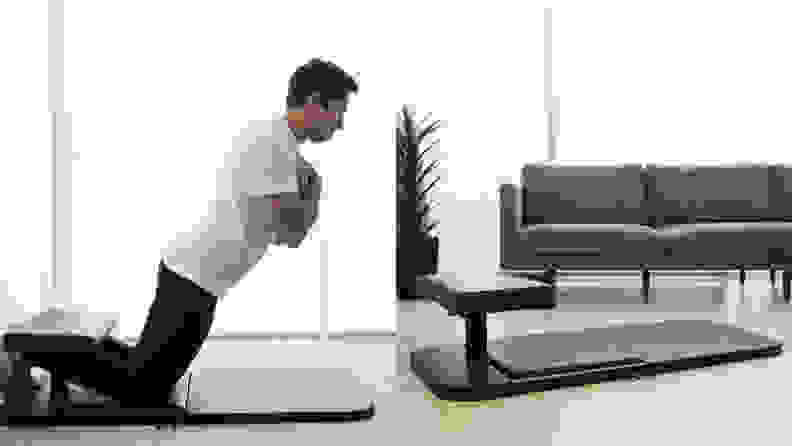 A man doing Nordic curls with the BaseBench.