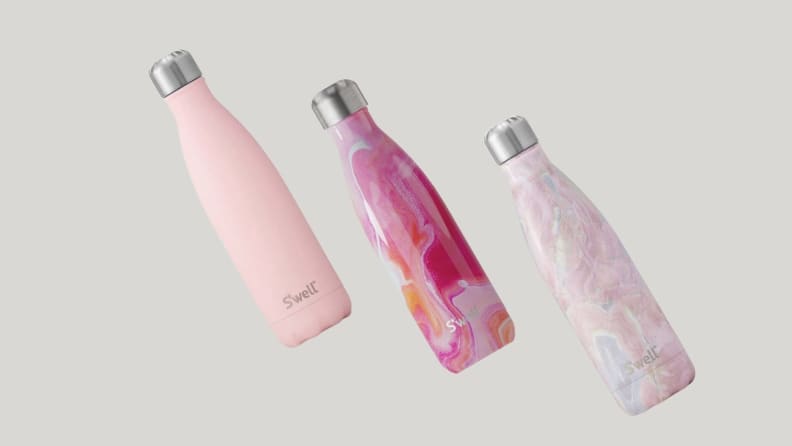 Three pink S'well water bottles
