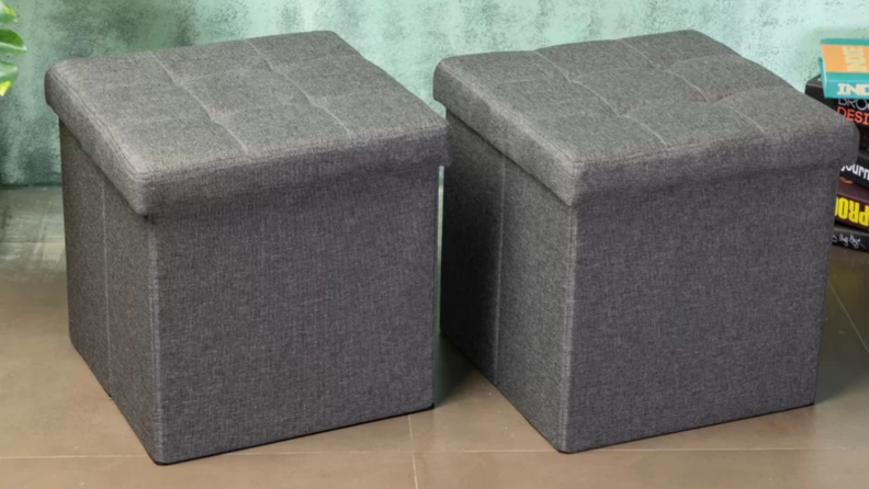 Two gray ottomans side by side