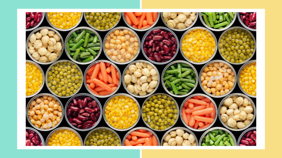 Multiple cans of preserved vegetables like green beans, carrots, peas, kidney beans and corn.