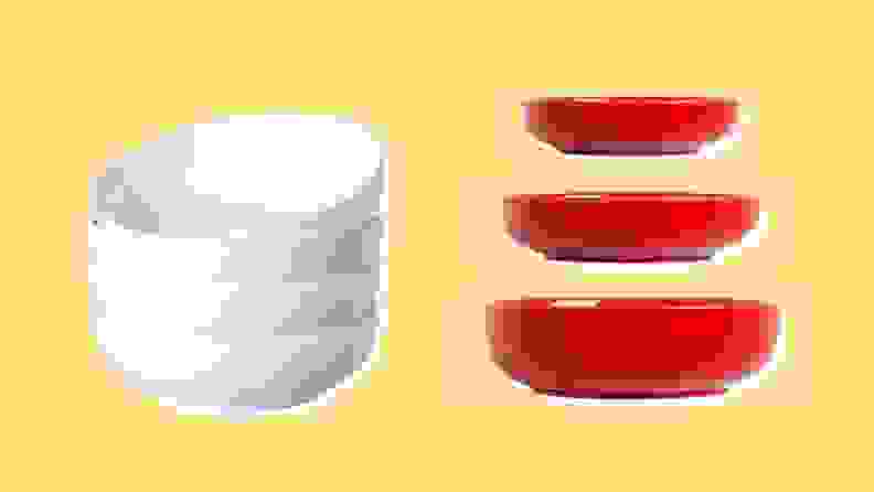 On the left: A stack of four white pasta bowls. On the right: Three different sized red pasta bowls.