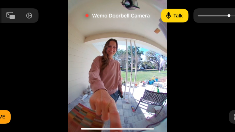 Image of a person ringing a video doorbell