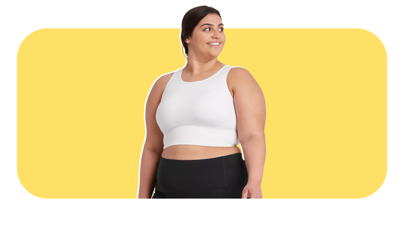 Model smiling while wearing white compression tank top and leggings from Target