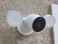A smarthome security camera mounted on a wall