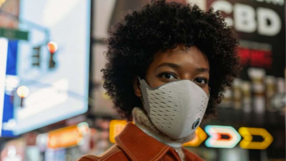 AirPop Active + smart face mask on a woman in a city