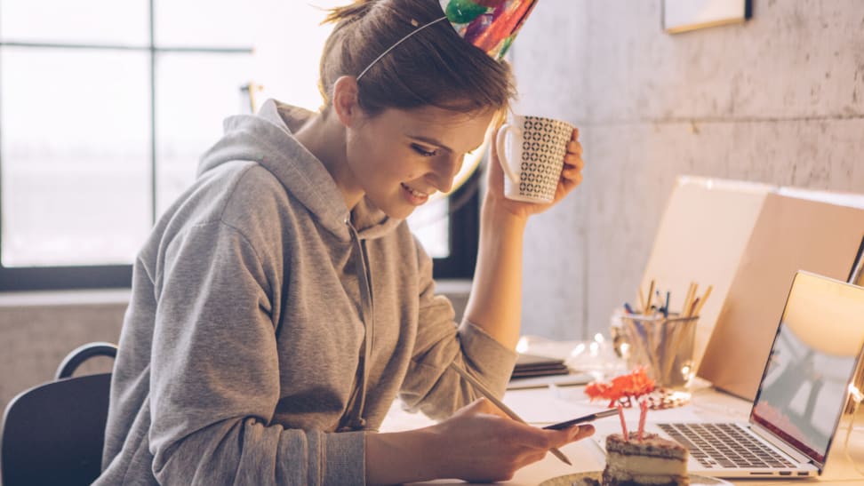 A woman having a party at her computer