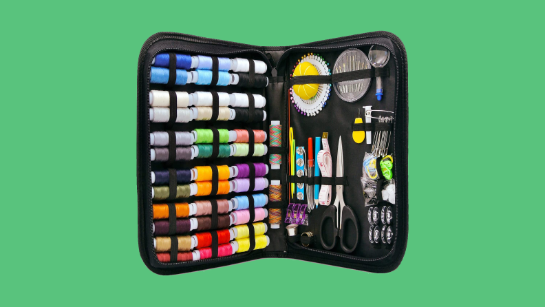 Sewing kit on green background