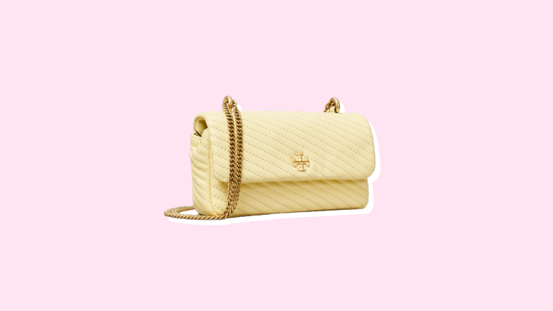 Photo of the Tory Burch Mini Kira Moto Quilt Flap Bag against a pink background.