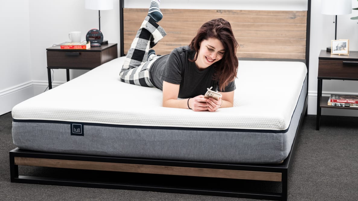 A person lies on their stomach on the lull Original mattress