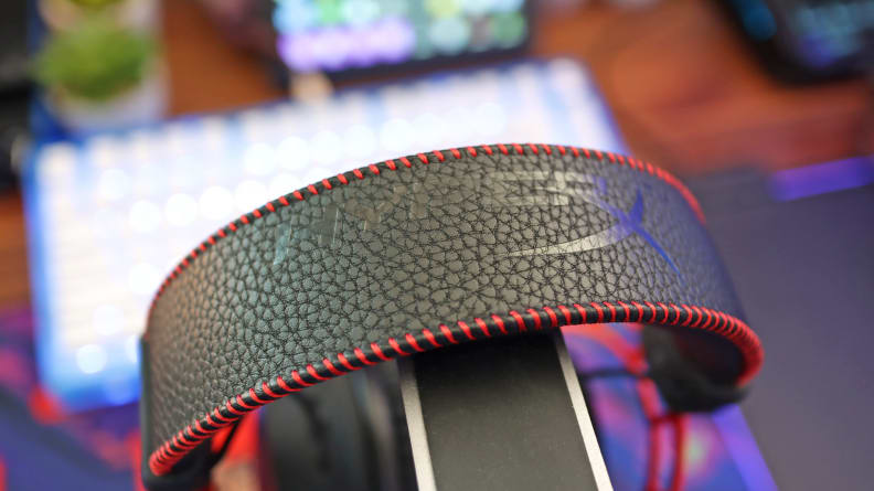 A close up of a black and red gaming headset headband