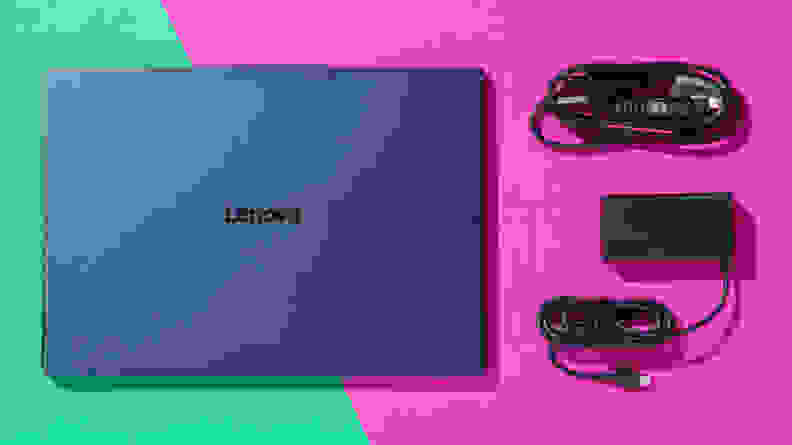 Lenovo Yoga Slim 7x next charge cord and USB cords on a teal and pink background.