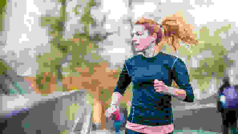 A woman running in the park.
