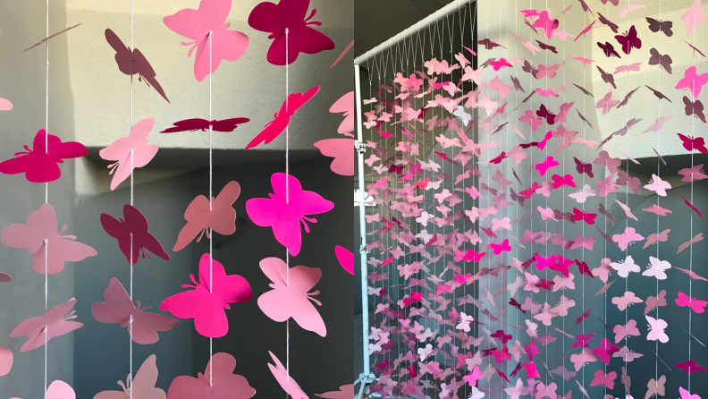 Two images of hanging pink butterfly decorations.