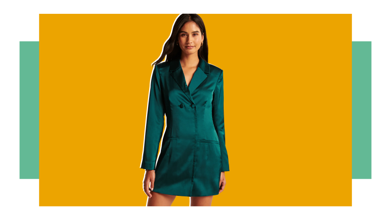 A woman in a green satin blazer Abercrombie & Fitch dress.