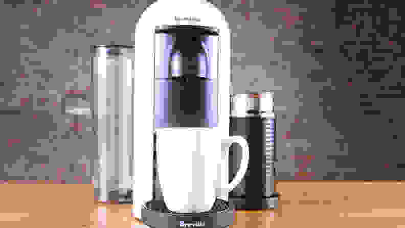 A white Nespresso VertuoPlus single-serve coffee maker.