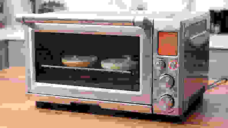 Bagel toasting in a toaster oven.