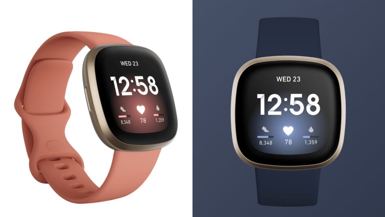 A pink and blue FitBit watch.